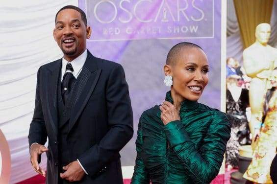 Will Smith and Jada Pinkett Smith pose on the red carpet during the Oscars arrivals at the 94th Academy Awards in Hollywood, Los Angeles, California, U.S., March 27, 2022. REUTERS/Mike Blake